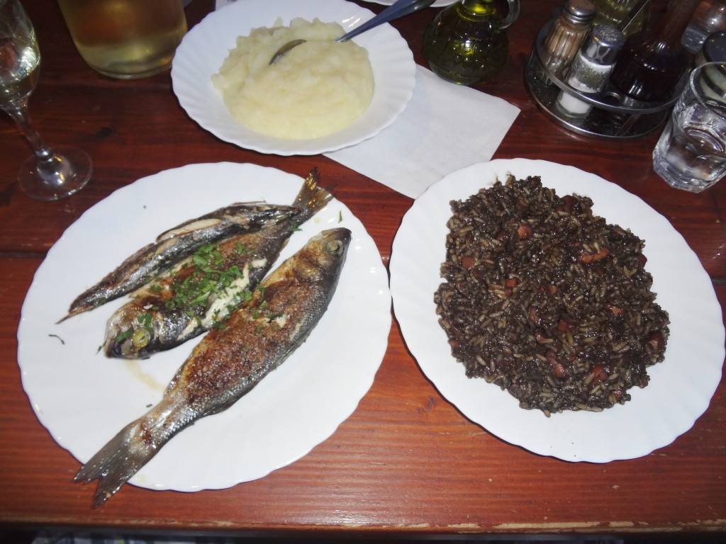 Cuttlefish risotto, fish and tators in Split, Croatia